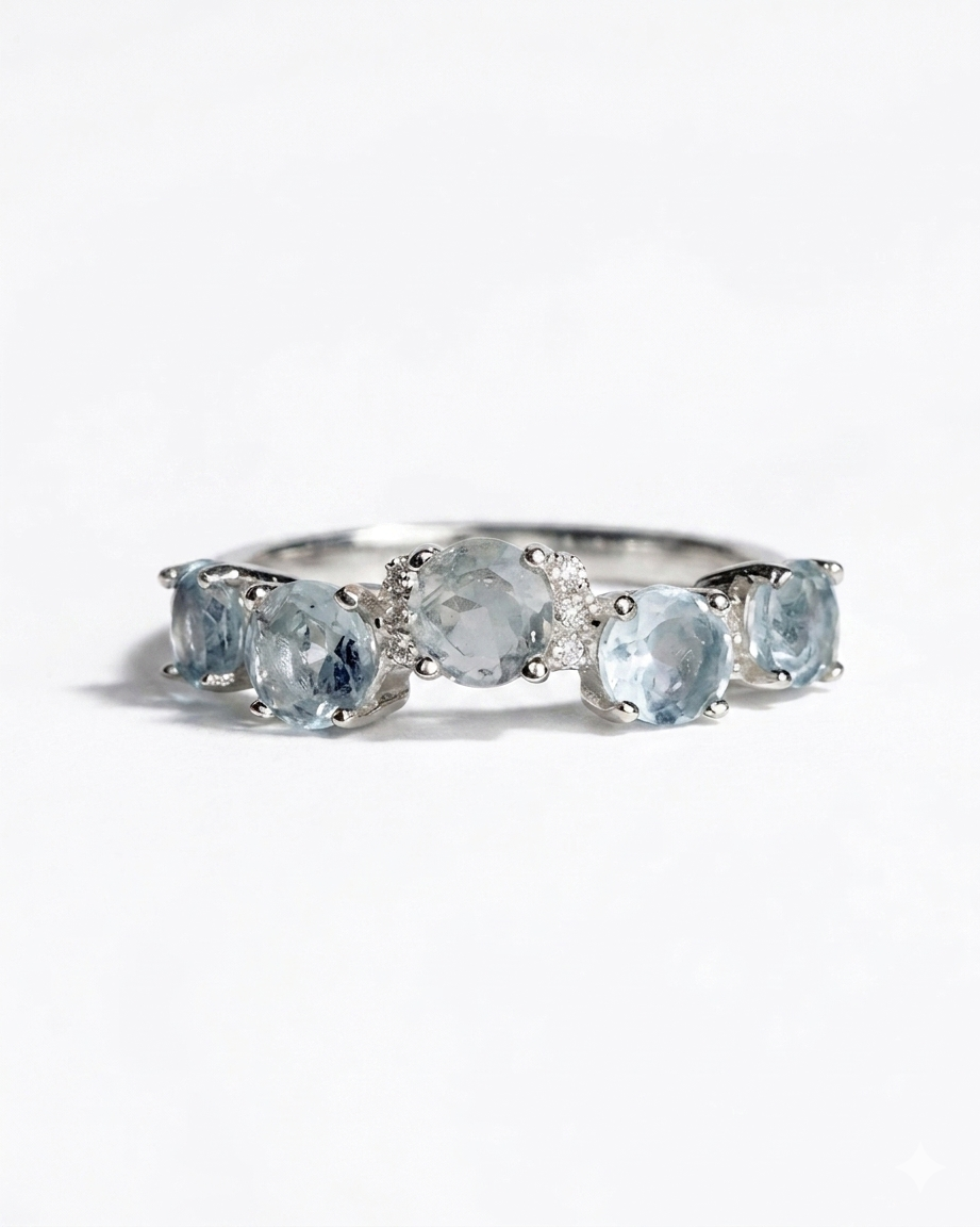 five aquamarine stones and cubic zirconia silver band