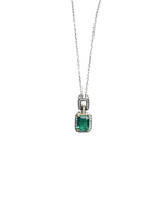 Natural emerald silver necklace with 18k gold plated claw setting and cubic zirconia on the side. Paired with 925 sterling silver.