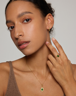 model wearing oval jade frame silver necklace paired with oval jade ring